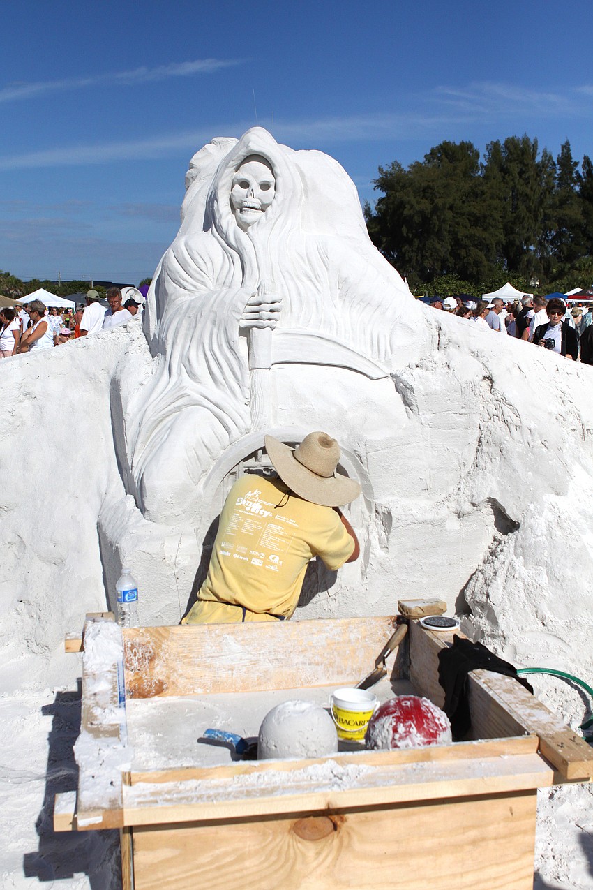 Bert Adams works on one side of the 