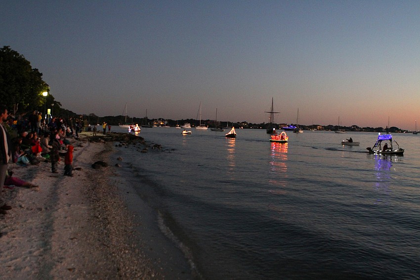 The dinghy parade makes its way around Bayfront Park.