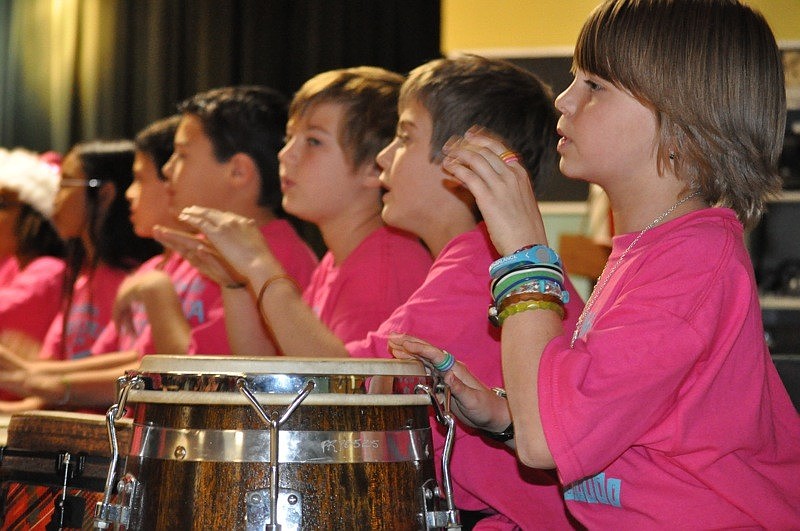 Briana Martin, right, kept rhythm on the drum.