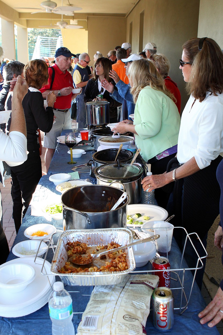 People line up for some chili on Friday, Jan. 28 during Longboat Key Public Tennis Center's Chili Cook-off competition.