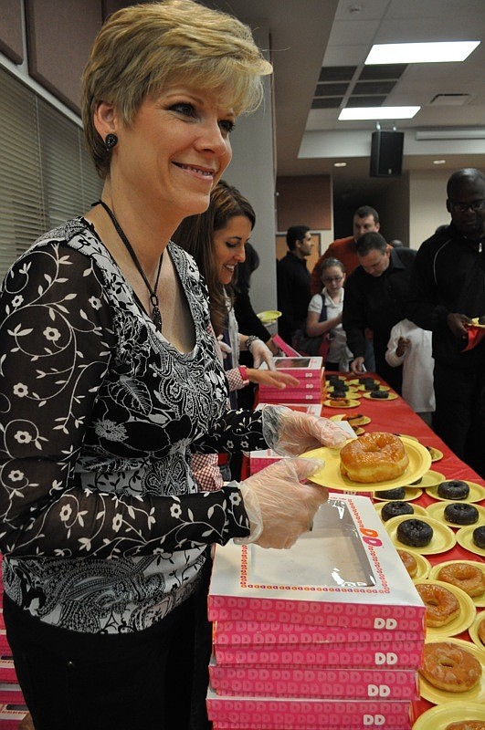 Parent-Teacher Organization mom Holly Pascarella passed out glazed doughnuts.