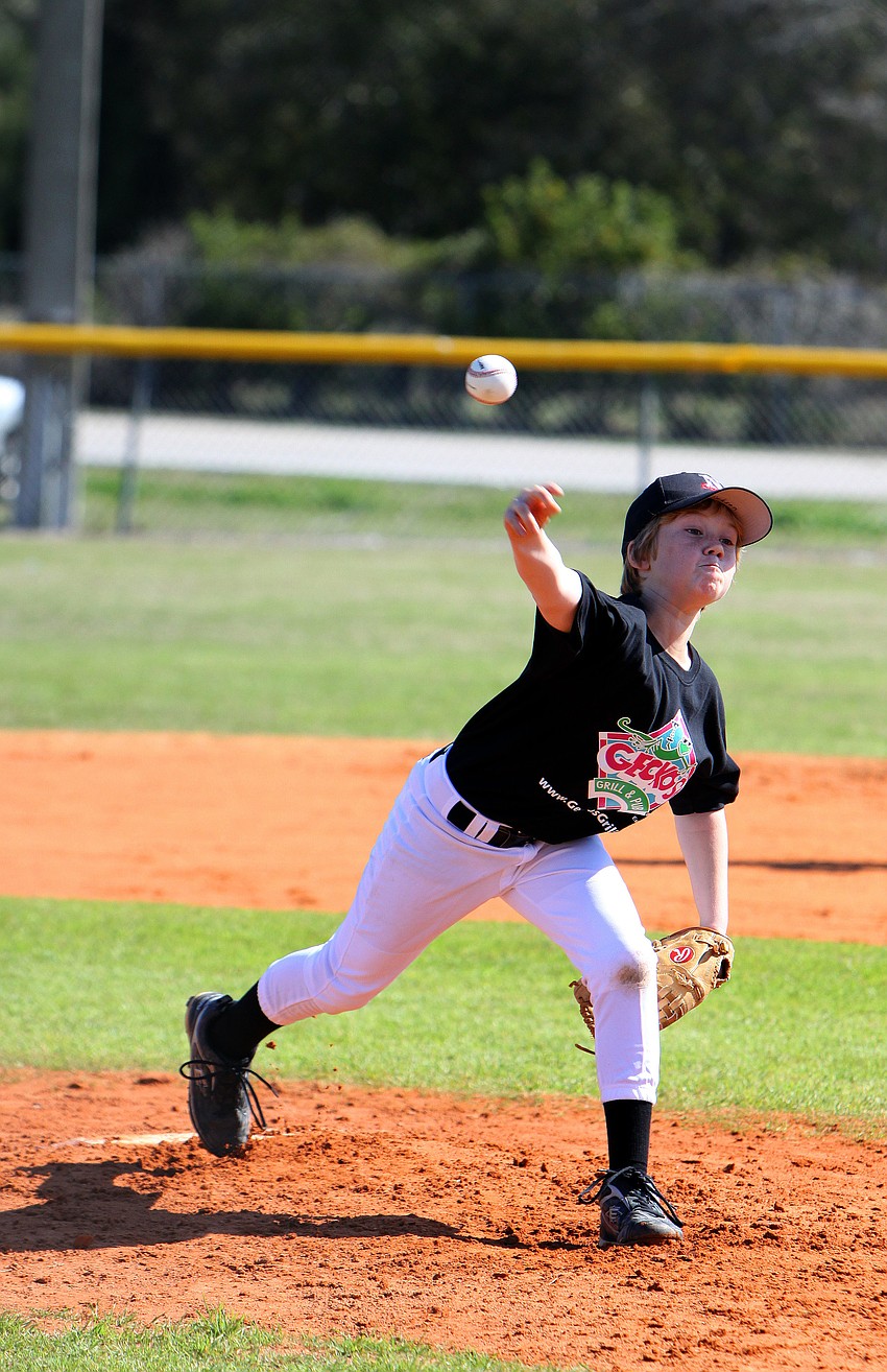 Jackson Temple, 10, throws a pitch towards home plate on Saturday, Feb. 19 at Twin Lakes Park during Central Sarasota Little League Opening Day.
