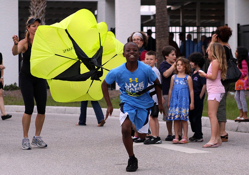 Tavares Campbell, 5th grader, tries out Definition Fit's running parachute to learn about wind resistance on Friday, Feb. 25 at Southside Elementary's Science Night.
