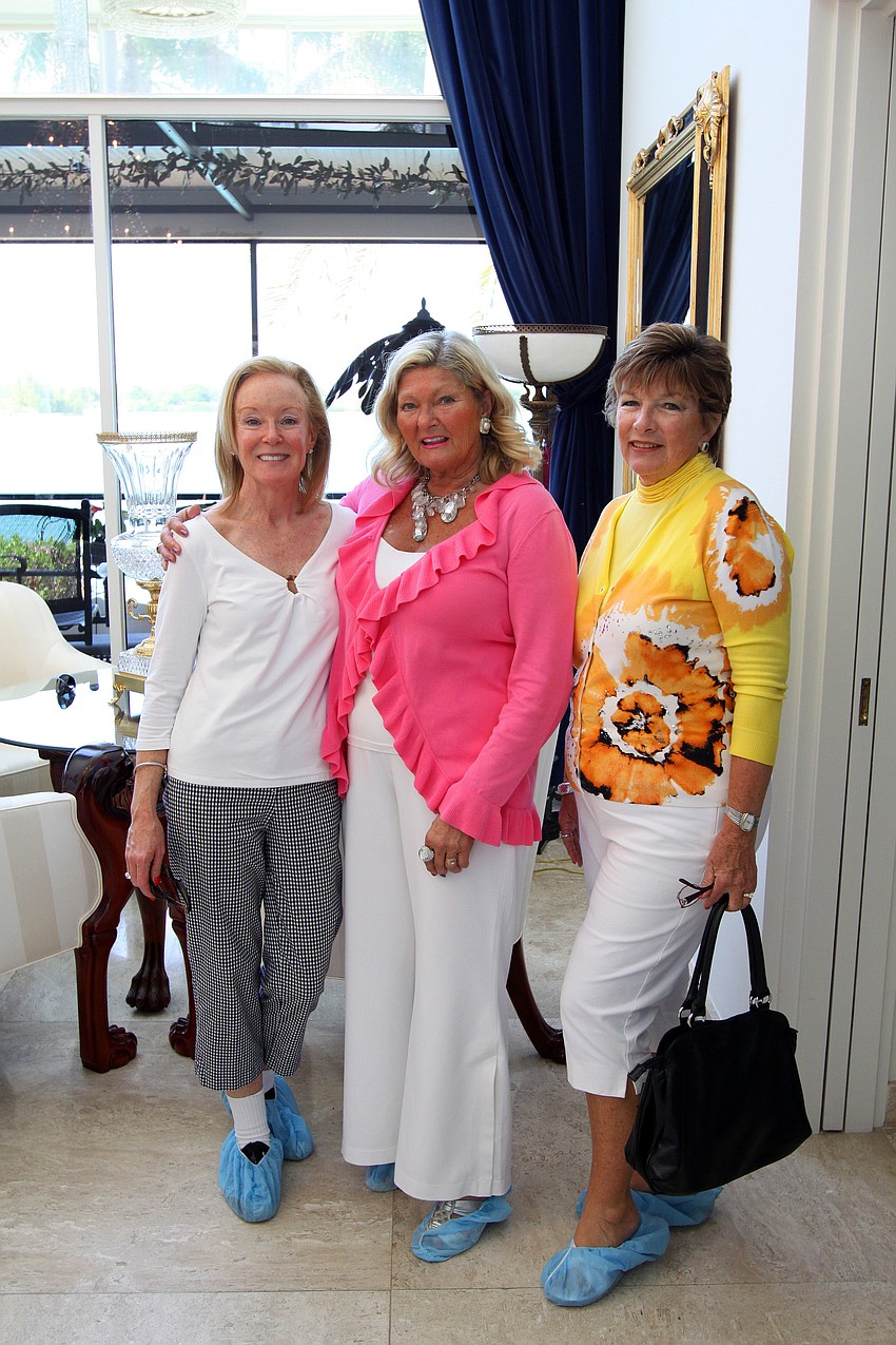 Donna Frieze, Heidi Lagro and Nancy Krieger on Saturday, March 5 in the foyer of the Trine home, one of the homes on the Home and Garden Tour.