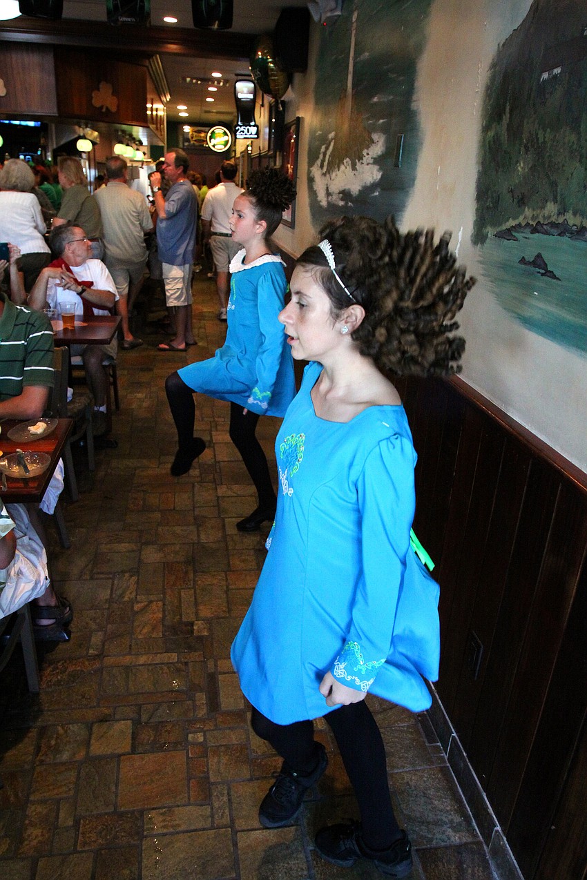 Alexis, 11, and Kelsey, 13, Worth perform inside Lynches Pub on Thursday, March 17 for their annual St. Patrick's Day party.
