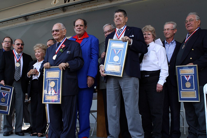 The newly inducted circus legends stand with their sponsors for a photo opportunity near the end of the ceremony.