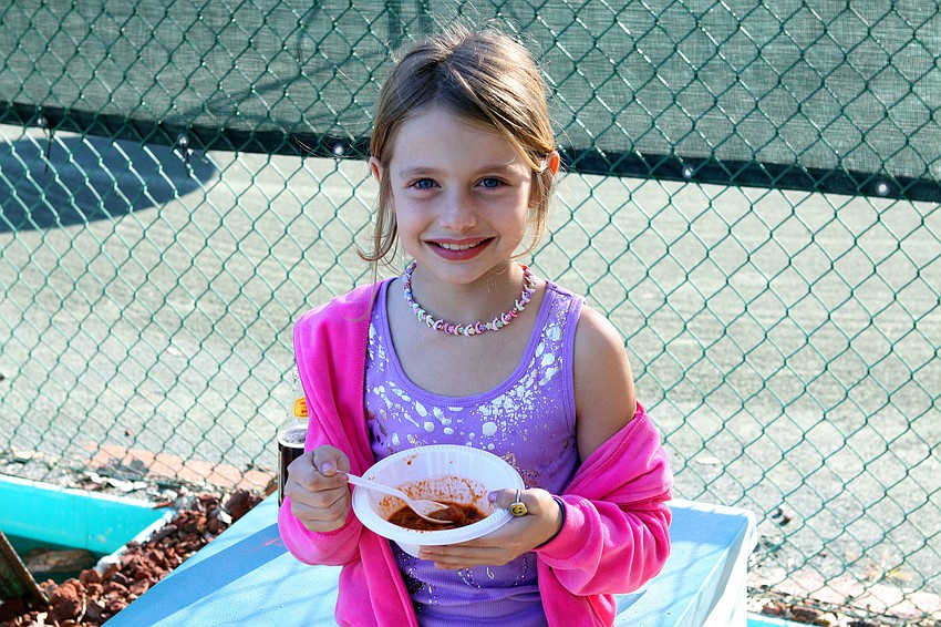 Gianna Sparks, 8, enjoys some chili on Friday, Jan. 28 during Longboat Key Public Tennis Center's Chili Cook-off competition.