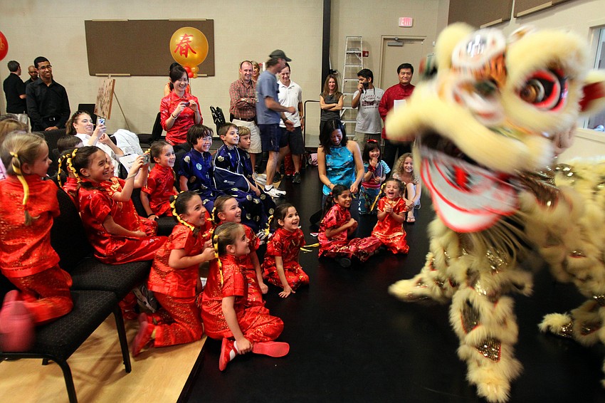 Justin Och and Cathy Morgan of the Lion Dance Team from Lakeland get quite a reaction from the students of St. Stephen's Episcopal School on Saturday, Jan. 29 at the 2011 GCAA Chinese New Year Celebration held at T.J. Johnson Youth Center.