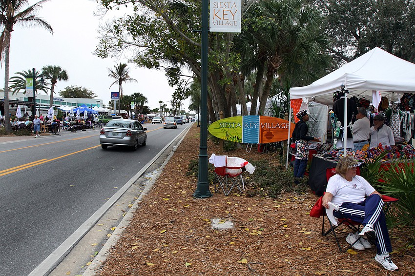 A view of the crowded sidewalks and main road in Siesta Key Village on Saturday, Feb. 5.