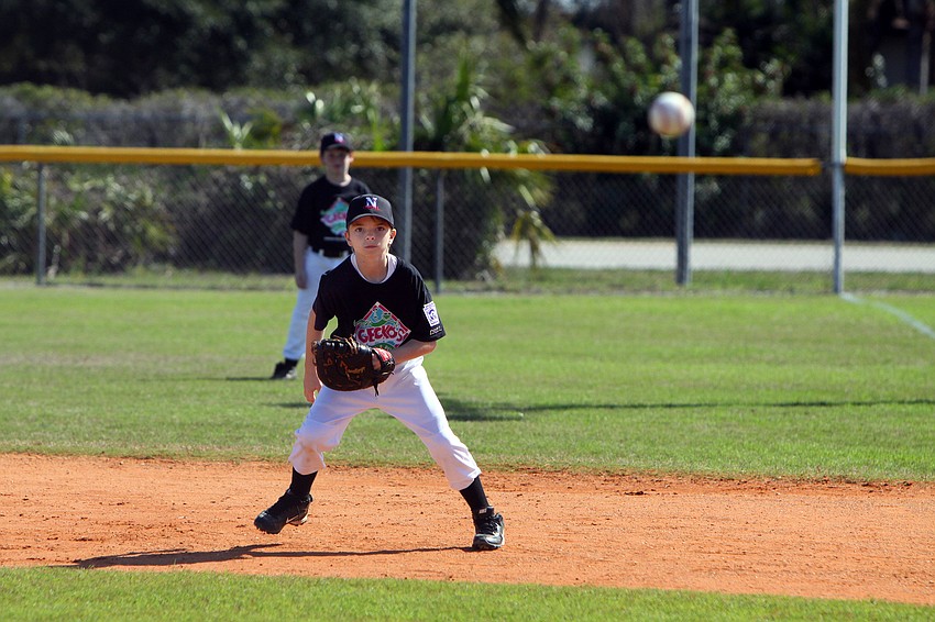 Bryan Wacha, 10, gets ready to go for the ball during his game on Saturday, Feb. 19 at Twin Lakes Park during Central Sarasota Little League Opening Day.