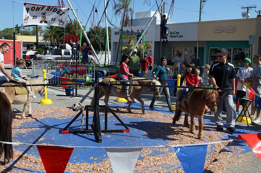Children enjoy pony rides on Saturday, March 12 at the Sham Rock Festival on Hillview.