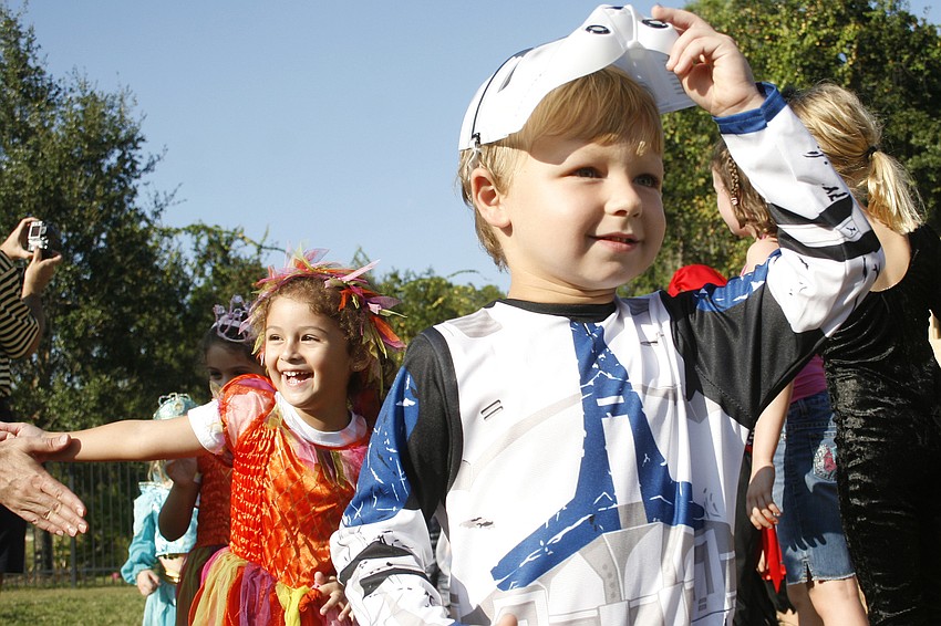 Connor Rielly removed his mask to get a better view of the parade route.