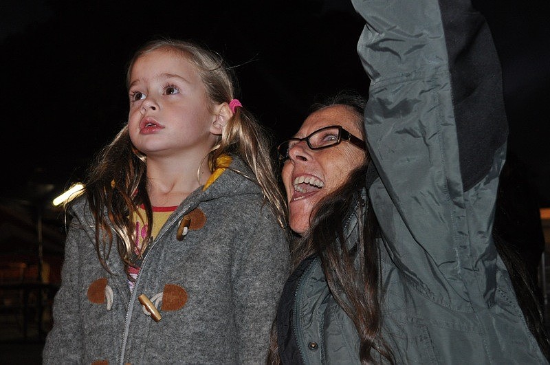 Chloe Huth, 5, with her grandmother Debbie Roberts, was mesmerized by the Pirates of the Colombian Caribbean show.