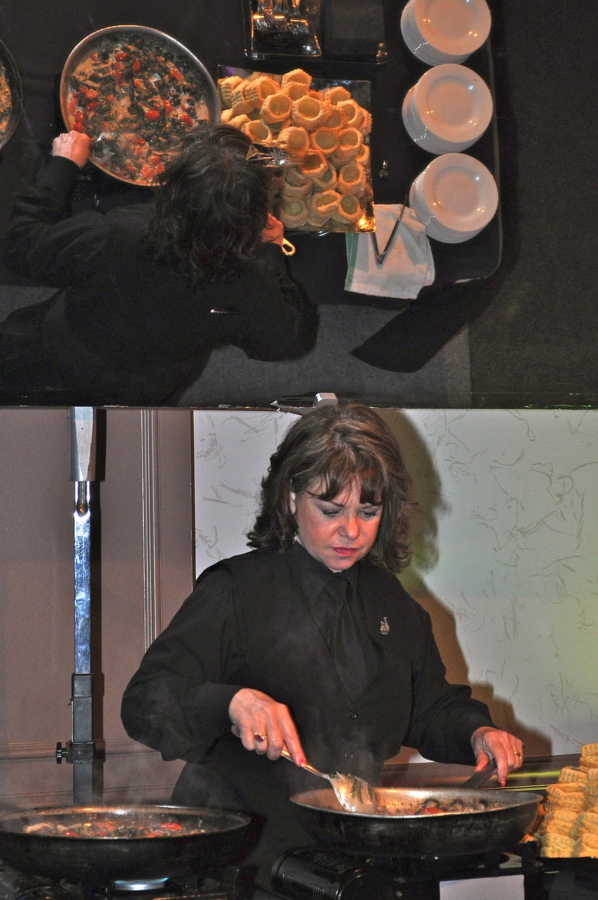 Peggy Millis serves escargot over puff pastry.