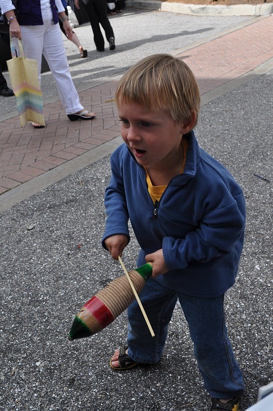 Jamesey Timpson, 3, tried out several instruments at the Sarasota Orchestraâ€™s instrument petting zoo.