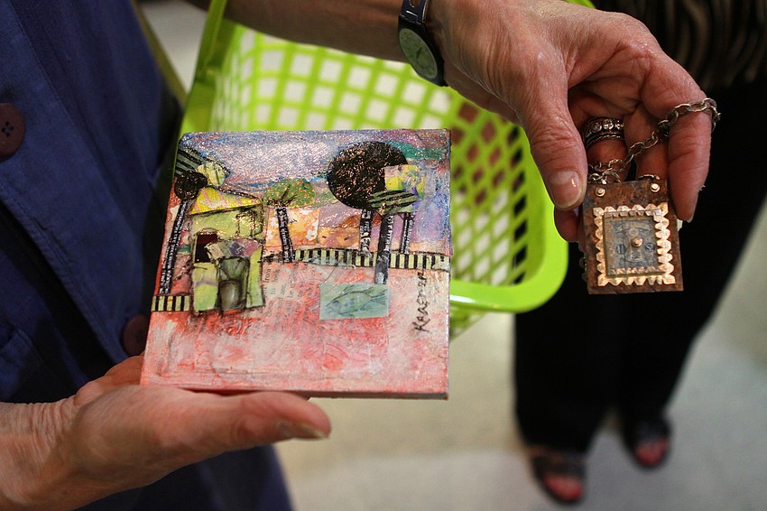 Nancy David shows off some of the pieces she bought on Thursday, Feb 10 at the Fabulous Arts Boutique.