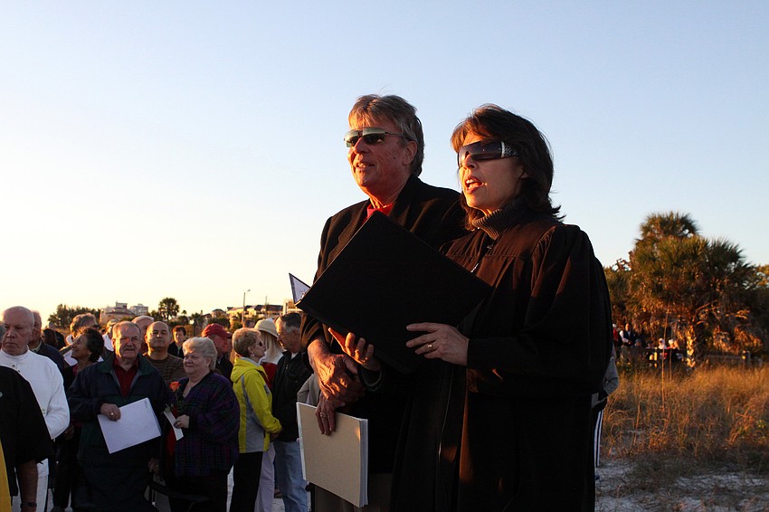 Attorney Elliott Metcalfe and Judge Becky Titus speak to the crowd of over 300 people who attended the Say I Do, Again ceremony, Monday, Feb. 14 on Siesta Key Beach.