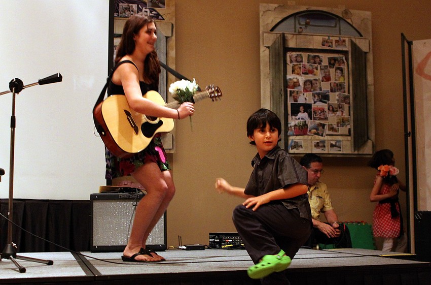 Noah Lienweber was in charge of handing out flowers to the performers on Feb. 26 at Temple Sinai's 2nd Annual 