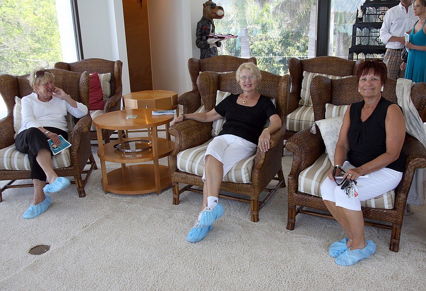 Carol Marran, Marilyn Norland and Claudia DeGrazia enjoy the third floor home movie theater room on Saturday, March 5 at the Trine home, one of the homes on the Home and Garden Tour.