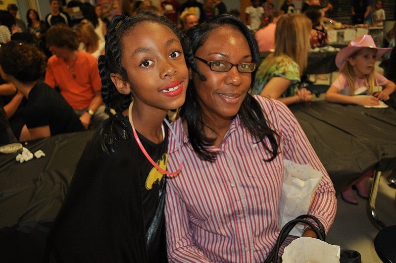 Myra and Janette Shoates feasted on freshly popped popcorn.