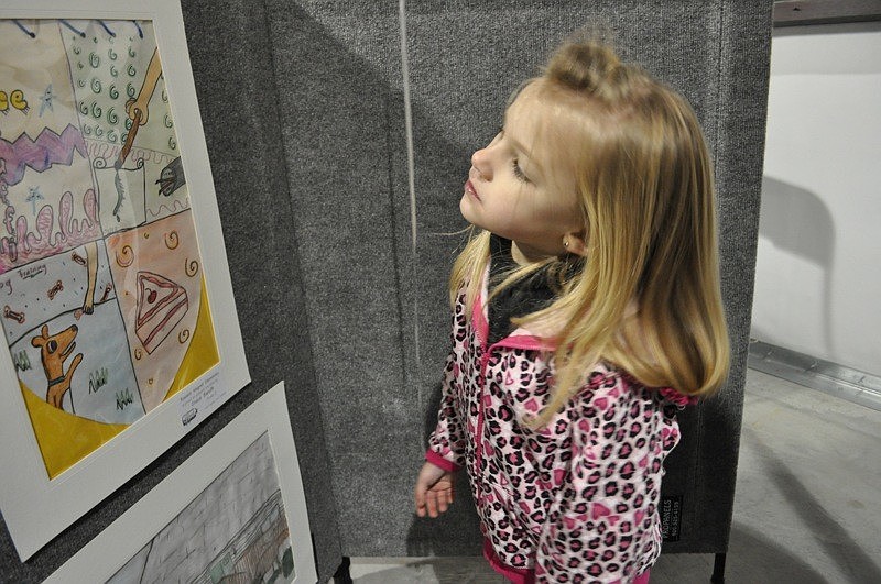 Four-year-old Ali Karst enjoyed looking at the art exhibit.
