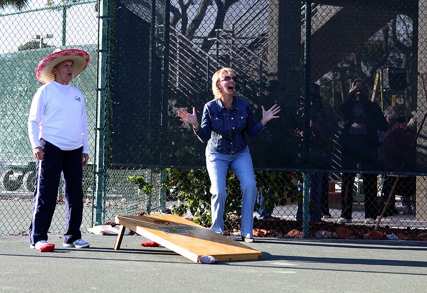 Cathy Powell and Kim Lawrence react during a game of cornhole on Friday, Jan. 28 during Longboat Key Public Tennis Center's Chili Cook-off competition.