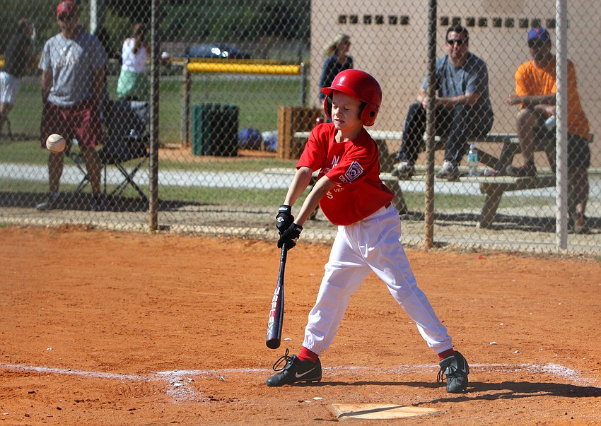 Everest Moll, 10, hits the ball on Saturday, Feb. 19 at Twin Lakes Park during Central Sarasota Little League Opening Day.