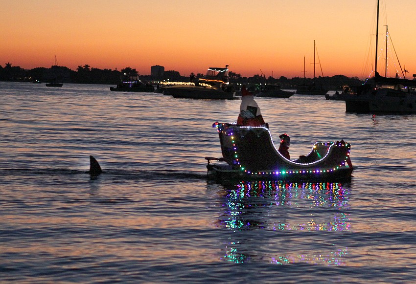 One dinghy was turned into a sleigh and included an inflatable Santa and a mysterious shark fin following close behind.