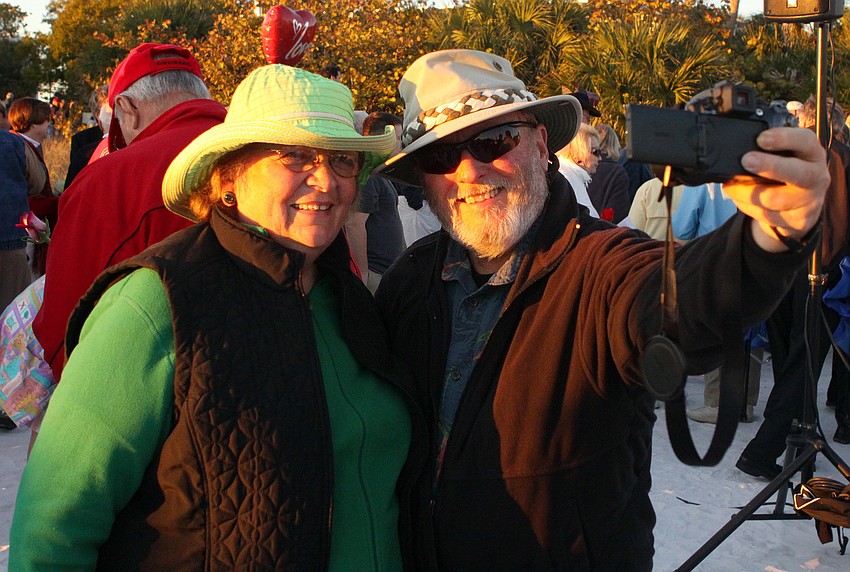 Jeanne and Rolly Standish, married for 30 years, take a photo of themselves after the Say I Do, Again ceremony, Monday, Feb. 14 on Siesta Key Beach.