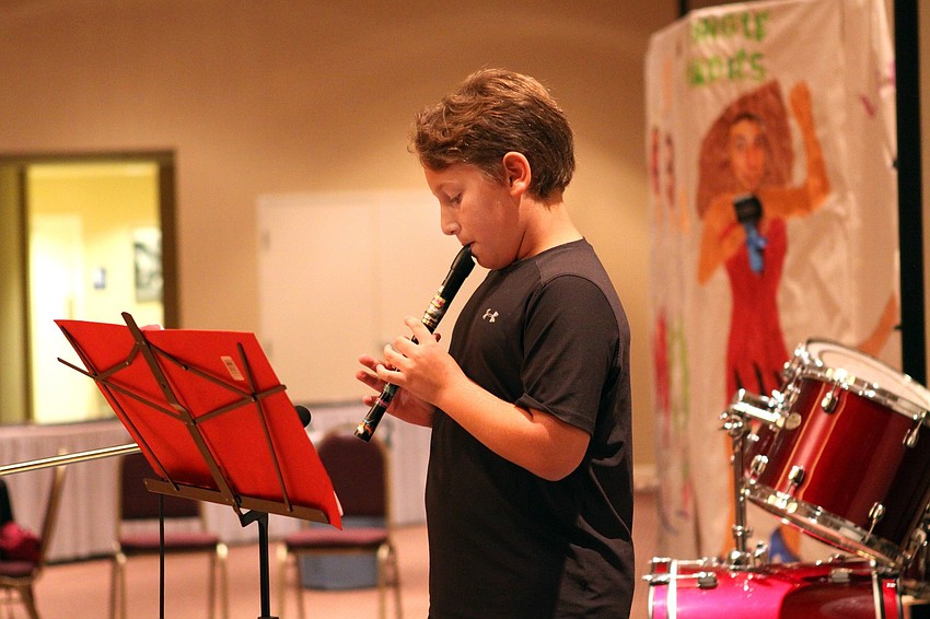 Jacob Carnes, 10, plays the recorder on Feb. 26 at Temple Sinai's 2nd Annual 