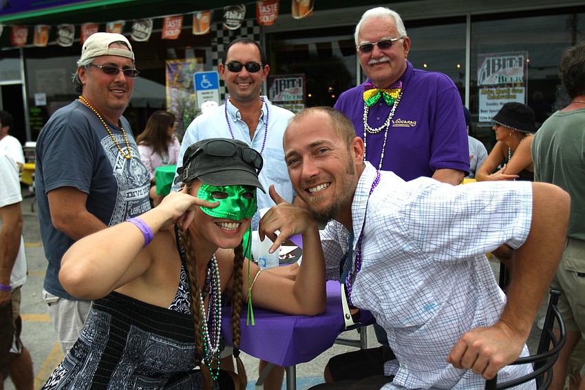 Katrin Roote, Ken Frank, David Lehrman, Fred Smith and Cory Zarem pose for a photo on Sunday, March 6 during the 1st Annual Sarasota Mardi Gras held at Voocaray in Gulf Gate.
