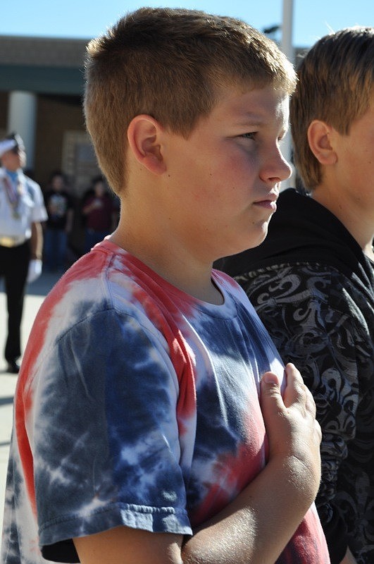 Alex Williams stood for the Pledge of Allegiance.