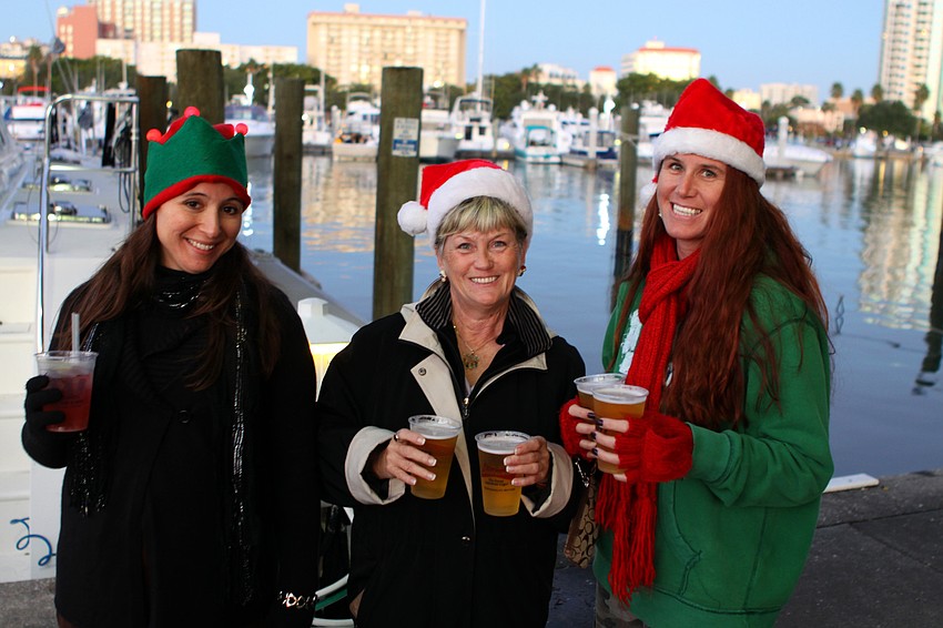 Anty Tomasi, Dot Schaeffer and Darcy Tomasi dressed for the holiday season for the boat parade on Saturday, Dec. 11 at Bayfront Park.