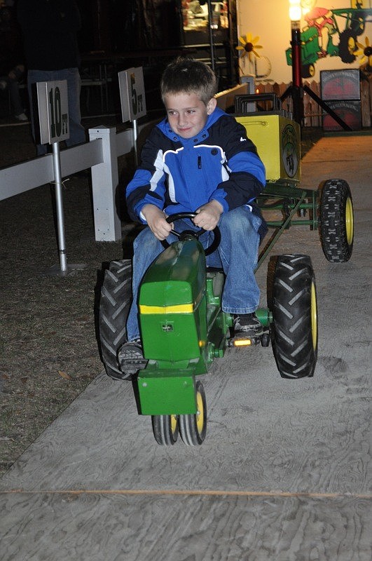Cameron Vickers, 8, made it to the next round of the Kids Tractor Pull.