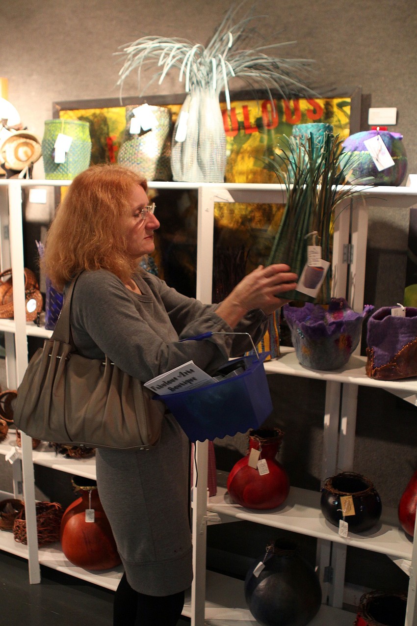 Carolyn Greber looks at some of the art work at the Fabulous Arts Boutique. Greber loves to 