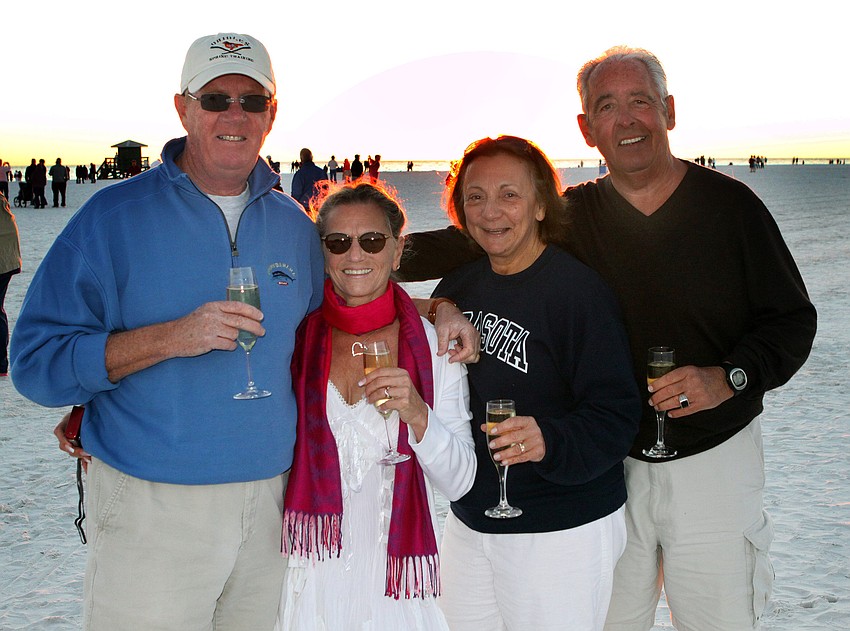 Johnny and Barbara Walker, married for 46 years, and good friends, Marianna and Ronald Peek, married for 42 years, enjoy some champagne after the Say I Do, Again ceremony, Monday, Feb. 14 on Siesta Key Beach.