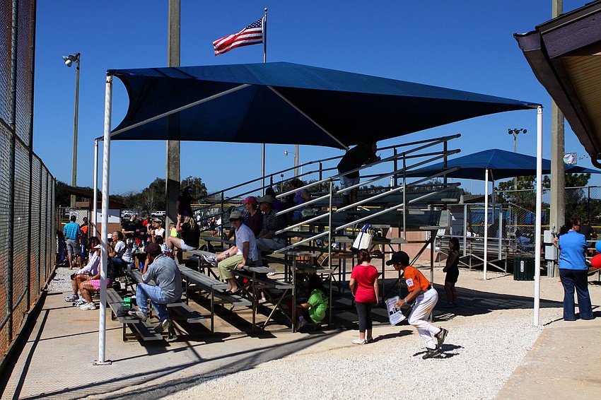Parents and siblings sit in the stands watching one of the many games that were played on Saturday, Feb. 19 at Twin Lakes Park during Central Sarasota Little League Opening Day.