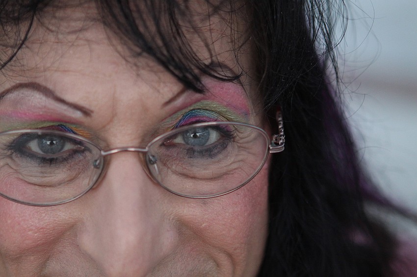 A close up on Jimi Gee's eye make-up. Gee plays his guitar every weekend at the farmers market.