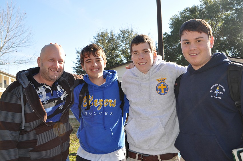 Youth Pastor at Abundant Life Church, Andy Ard, with SCS students Josh Beachy, Logan Mayer and Stanley Yoder