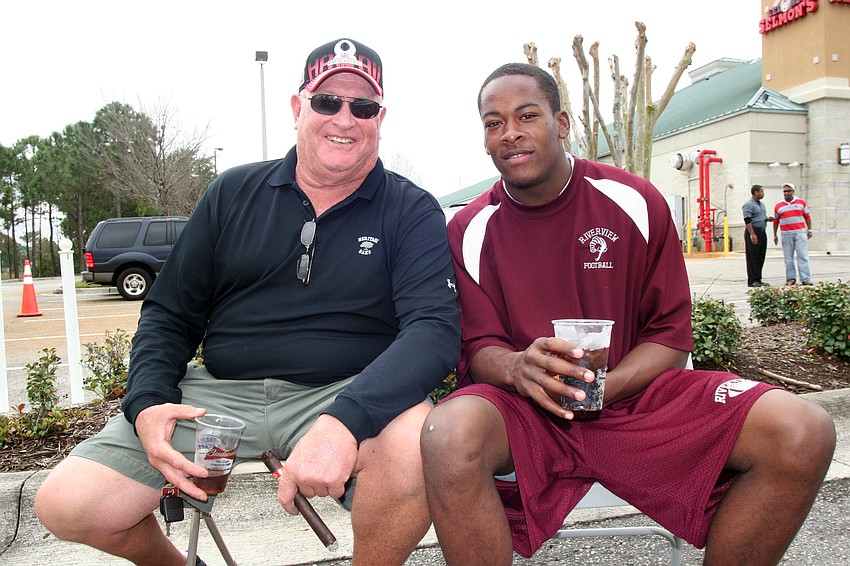 Riverview High coach John Sprague and junior Tater Williams led the quarterback skills demonstration.