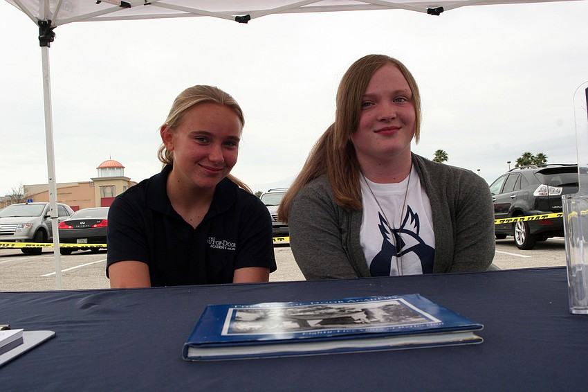 The Out-of-Door Academy eighth-grader Amy Cutmore and freshman Sarah Wilcox spent the afternoon volunteering.