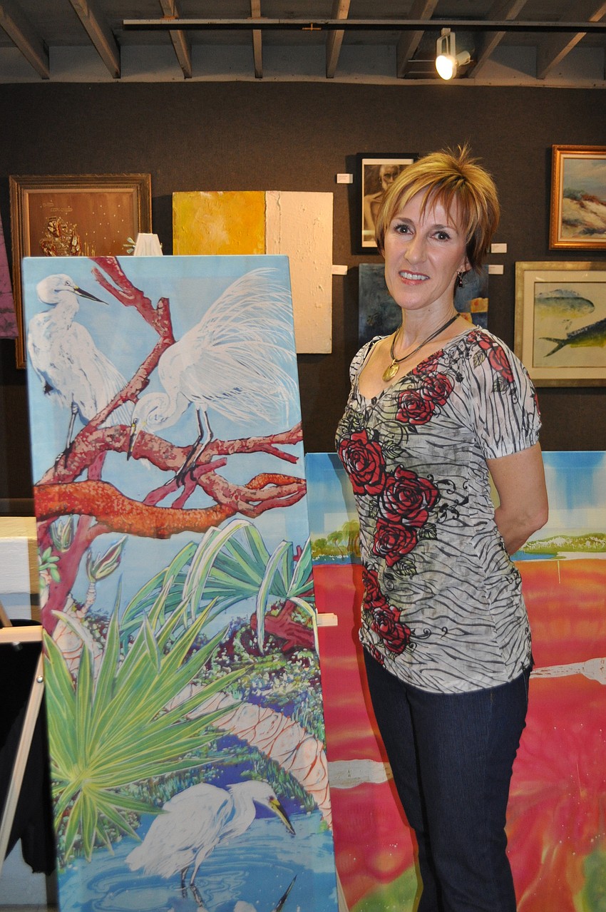 Artist Caryn Fenimore creates Batik paintings on silk.