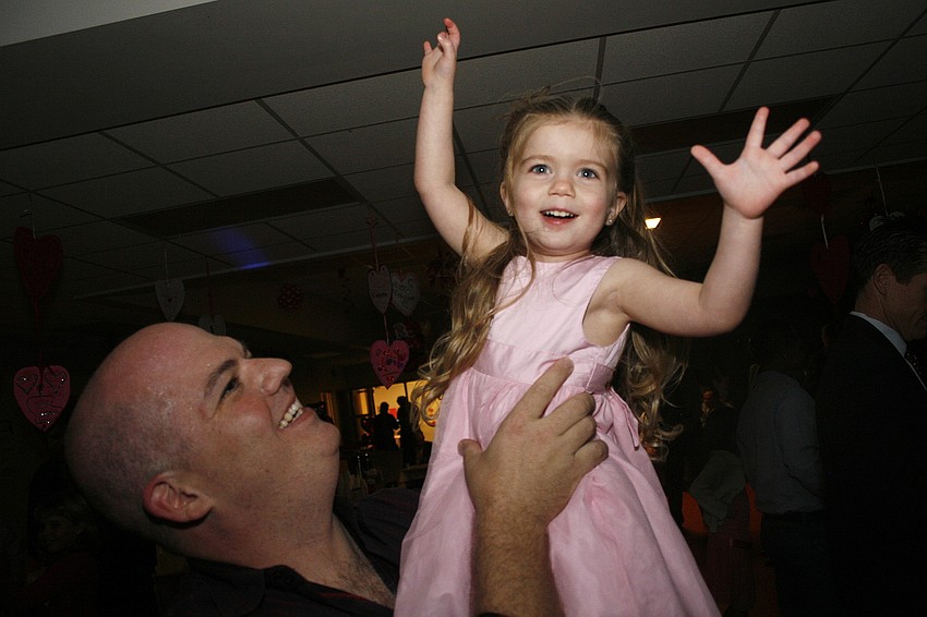 Jessie Cantrell twirled high in the air in the arms of her dad, Jeff.