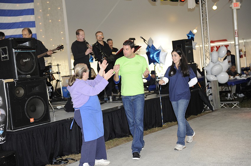 Nicholas Mitsis, Debbie Pazlaleis and Tiffany Birakis demonstrated a traditional Greek dance.