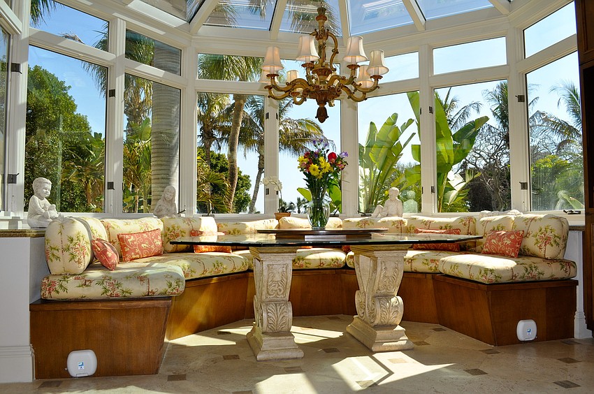 Magical Beachfront Mansion: A colorful breakfast area in the kitchen lets in lots of sunshine.