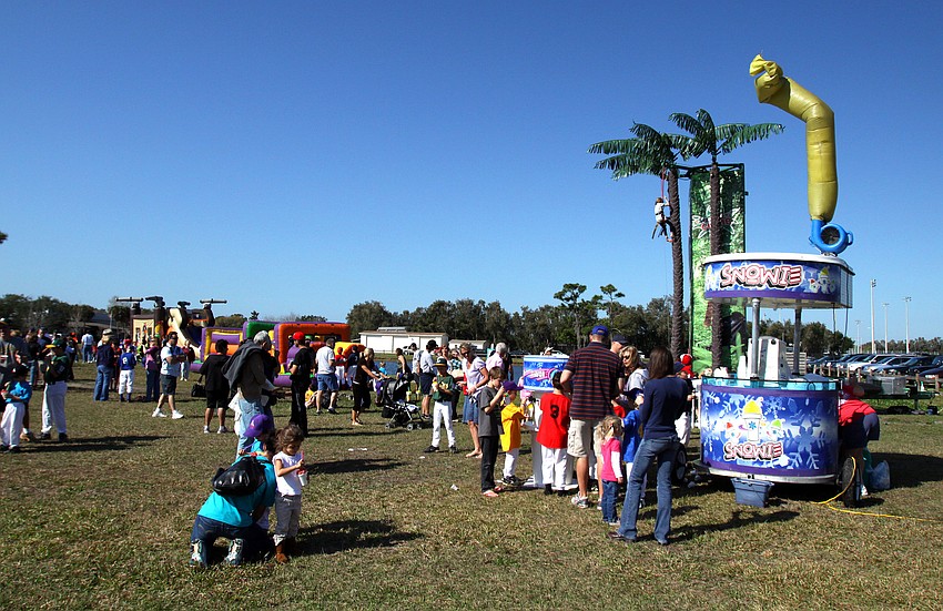 Ball players and their families enjoy some fun on Saturday, Feb. 19 at Twin Lakes Park during Central Sarasota Little League Opening Day.