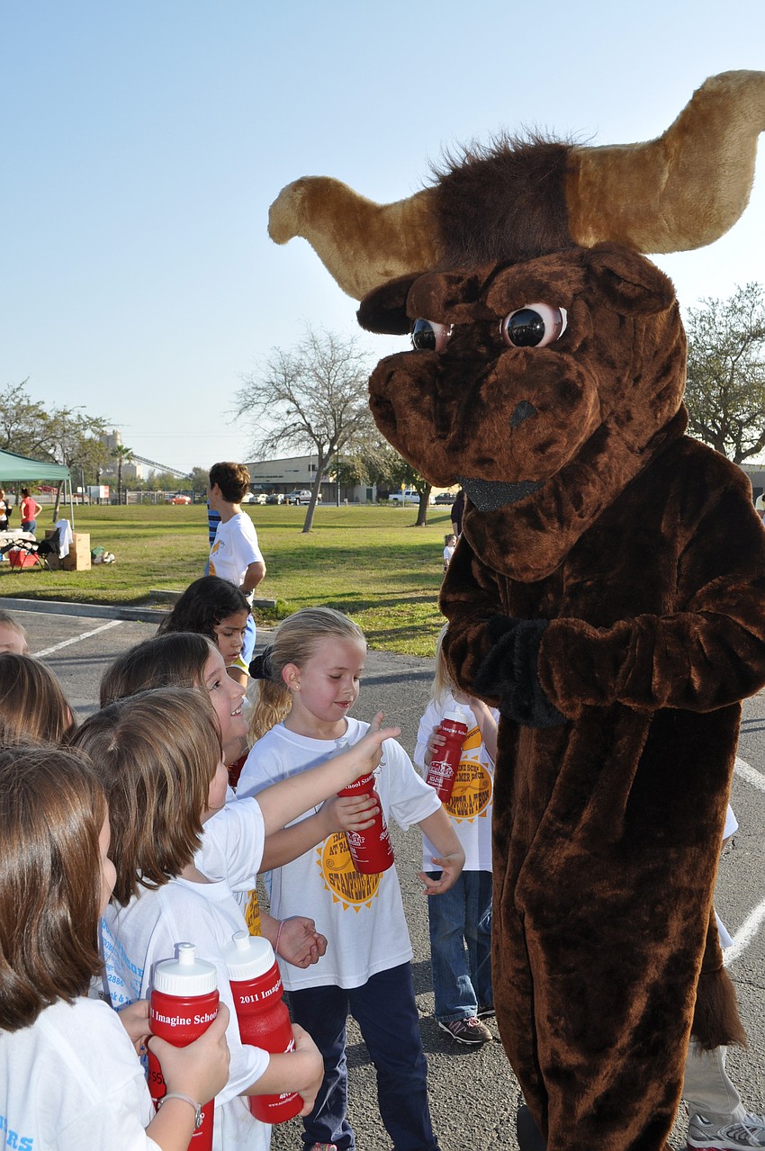 The school's mascot, Larry the Longhorn, cheered students on throughout the run.