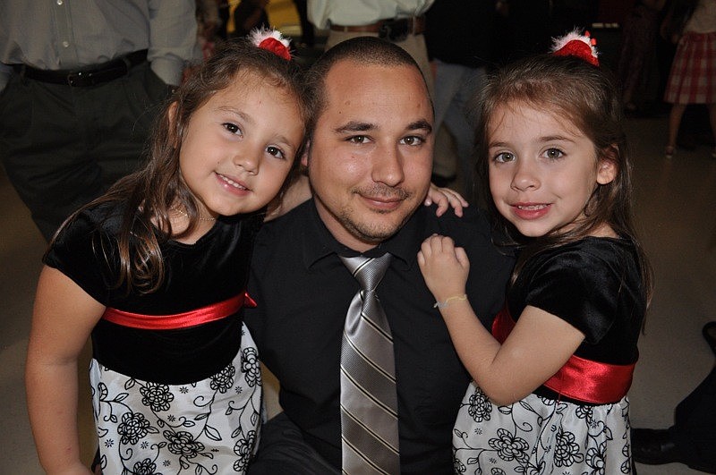 Taylor Deyo, 6, enjoyed with her dad, C.J., and sister Alexis Rozanski.