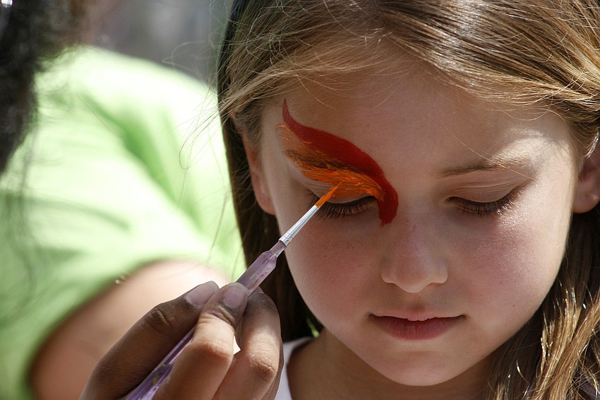Jordyn Golden, 7, sat perfectly still as she got her face painted.