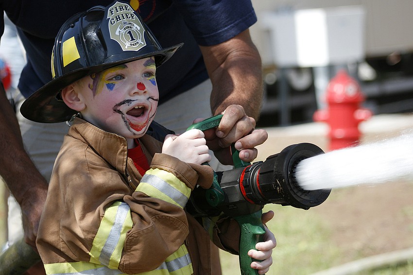 Cameron Locke, 2, completed the firefighter obstacle course, much to the delight of his parents.